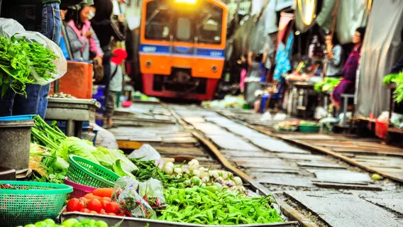 Damnoen Saduak Floating Market + Maeklong Railway Market One-Day Tour in Bangkok, Thailand